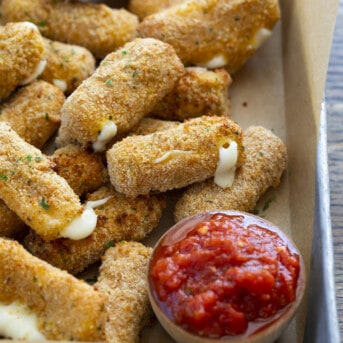 Mozzarella Sticks in a Pan with Marinara Sauce. Appetizers, Cheese Sticks, How to Make Cheese Sticks, How to Make Mozzarella Sticks, Superbowl Food, Football Appetizers, Easy Appetizers, Air Fryer Appetizers, Hot Appetizers, i am homesteader, iamhomesteader