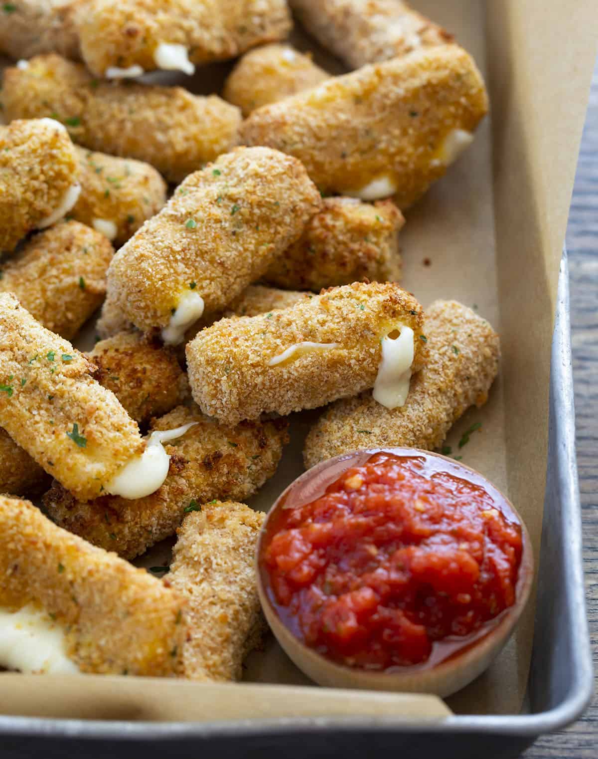 Mozzarella Sticks in a Pan with Marinara Sauce. Appetizers, Cheese Sticks, How to Make Cheese Sticks, How to Make Mozzarella Sticks, Superbowl Food, Football Appetizers, Easy Appetizers, Air Fryer Appetizers, Hot Appetizers, i am homesteader, iamhomesteader