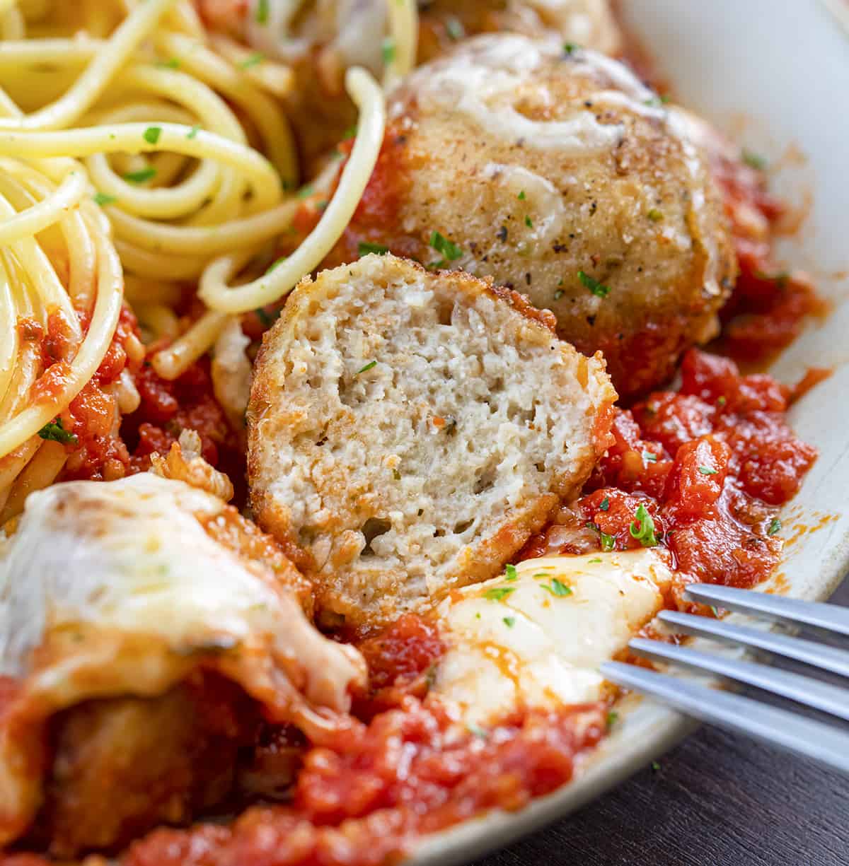 Cut Into Chicken Meatball Showing Inside Texture. Dinner, Supper, Meatballs, Chicken Meatballs, Chicken Parmesan Meatballs, Chicken Meatball Recipes, Chicken, Chicken Recipes, Christmas Dinner, i am homesteader, iamhomesteader