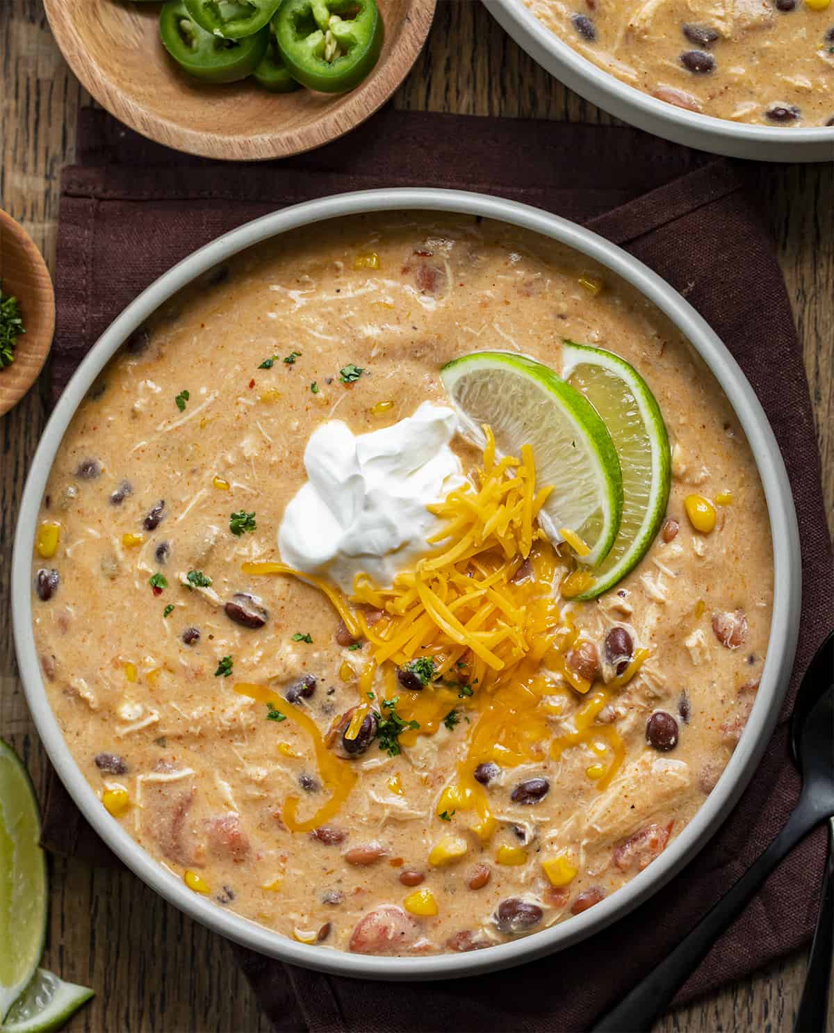 Creamy Chicken Taco Soup in a Bowl with Garnish. Soup, Comfort Soups, Soup Recipes, Soup Recipes, Creamy Soups, 7 Can Chicken Taco Soup, Seven Can Creamy Chicken Taco Soup, fall soups, Easy Soups, easy Soup Recipes, i am homesteader, iamhomesteader