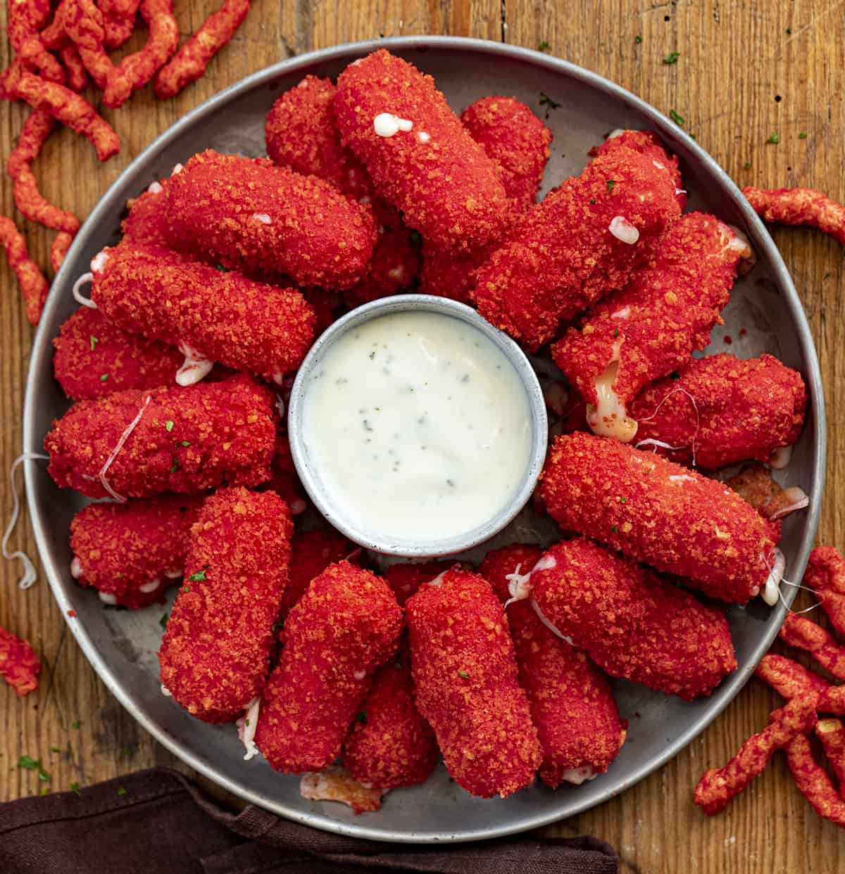 Hot Flamin Hot Cheeto Mozzarella Sticks on a Plate with Ranch Dressing. Appetizer, Cheese Sticks, Flamin Hot Cheese Sticks, SuperBowl Food, Football Snacks, Cheese Sticks Recipes, Football Appetizer Ideas, Party Appetizer Ideas, i am homesteader, iamhomesteader
