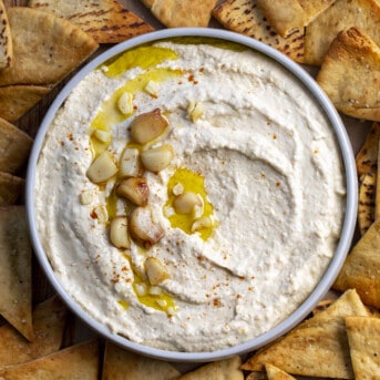 Bowl of Roasted Garlic Hummus. Hummus, Hummus Recipes, How to Make Creamy Hummus, Ice Cubes in Hummus, Appetizer, What to Eat with Hummus, recipes, i am homesteader, iamhomesteader