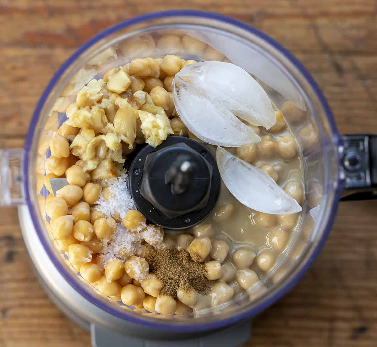 Ingredients for Roasted Garlic Hummus in Food Processor. Hummus, Hummus Recipes, How to Make Creamy Hummus, Ice Cubes in Hummus, Appetizer, What to Eat with Hummus, recipes, i am homesteader, iamhomesteader