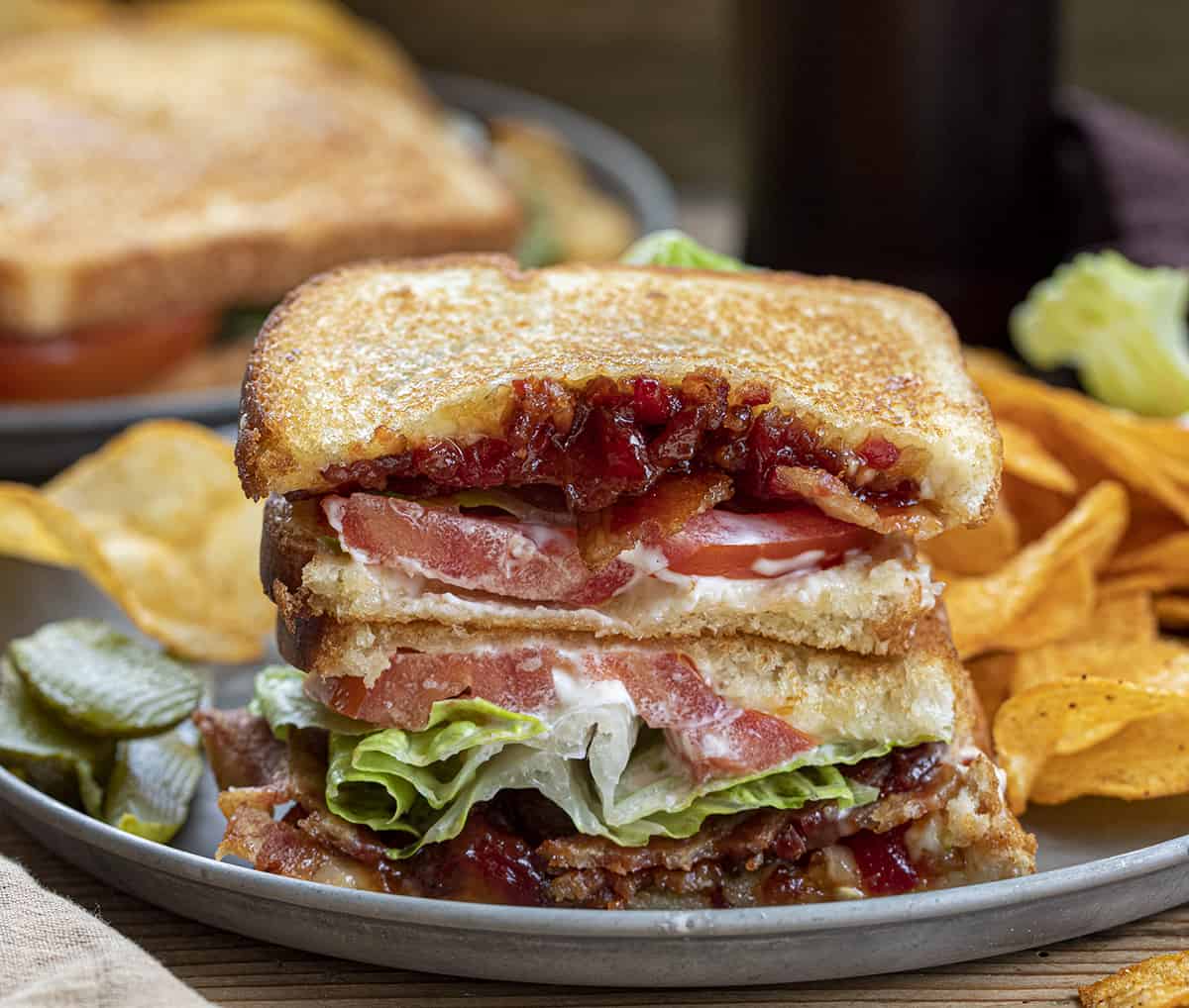 Stacked BLT with Bacon Tomato Jam on Plate with Chips. Dinner, Supper, Sandwich, Deluxe BLT, Tomato Jam Sandwich, How to Use Tomato Jam, Toasted BLT, recipes, i am homesteader, iamhomesteader