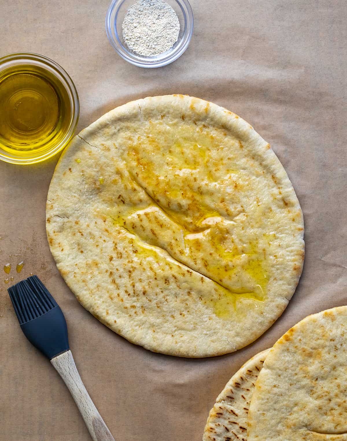 Pita Bread Brushed with Oil Before Making Pita Chips. Pita Chips, How to Make Pita Chips, Air Fryer Pita Chips, Pita Chips in the Oven, Seasoned Pita Chips, Crispy Pita Chips, recipes, Appetizers, i am homesteader, iamhomesteader