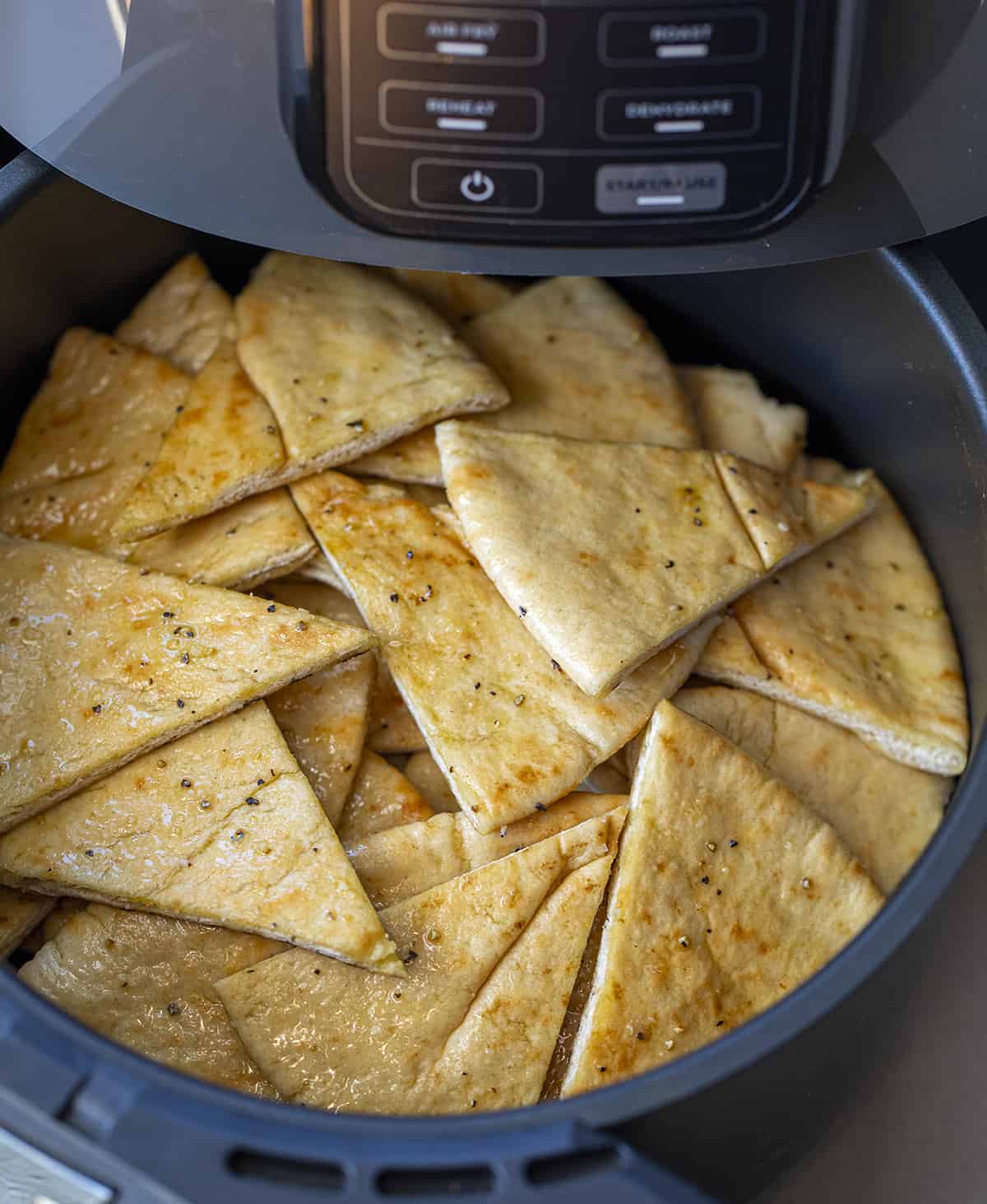 Pita Bread in the Air Fryer Before Cooking. Pita Chips, How to Make Pita Chips, Air Fryer Pita Chips, Pita Chips in the Oven, Seasoned Pita Chips, Crispy Pita Chips, recipes, Appetizers, i am homesteader, iamhomesteader