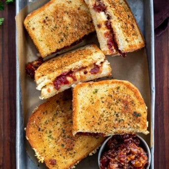 Grilled Cheese with Spicy Tomato Jam Sandwiches in a Pan with Bacon Jam. Appetizer, Dinner, Supper, Grilled Cheese, Sandwich, Cheese Sandwich, Super Bowl Food,Game Day Food, Best Sandwich Ever, i ma homesteader, iamhomesteader