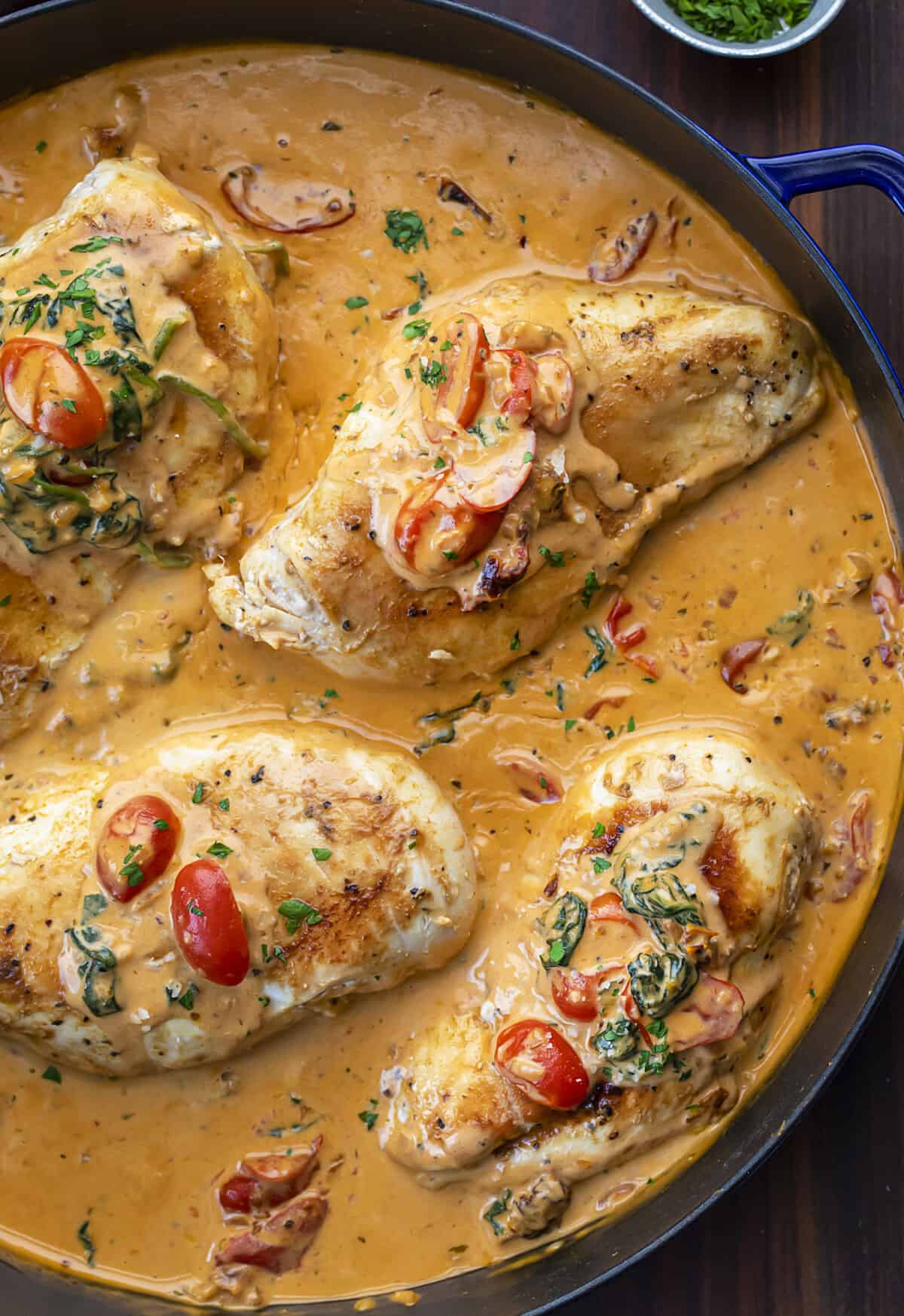 Skillet Filled with Tuscan Chicken Breasts Covered in Sauce. Dinner, Supper, Chicken Recipes, What to Cook for Dinner, Easy Chicken Recipe, How to Make Tuscan Chicken, What is Tuscan, Creamy Tomato Sauce Chicken, Kid Favorites Dinner, i am homesteader, iamhomesteader