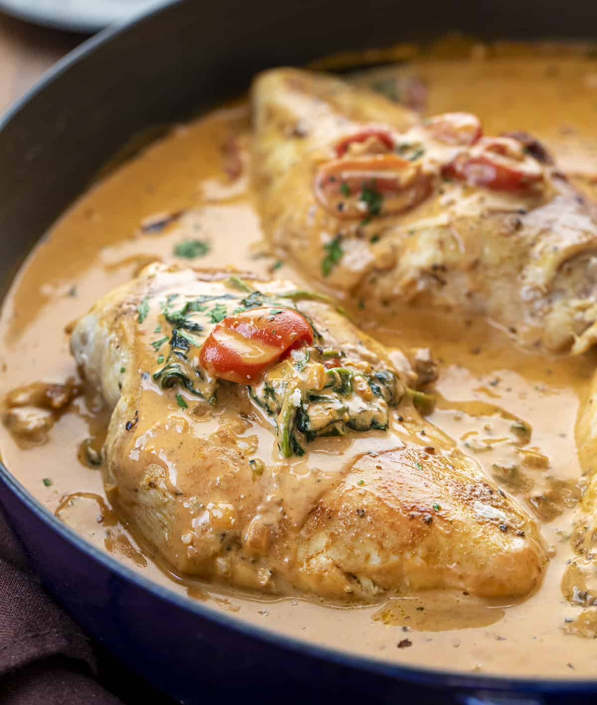Creamy Tuscan Chicken in a Pan with Sauce Drizzled Over the Chicken Breasts. Dinner, Supper, Chicken Recipes, What to Cook for Dinner, Easy Chicken Recipe, How to Make Tuscan Chicken, What is Tuscan, Creamy Tomato Sauce Chicken, Kid Favorites Dinner, i am homesteader, iamhomesteader