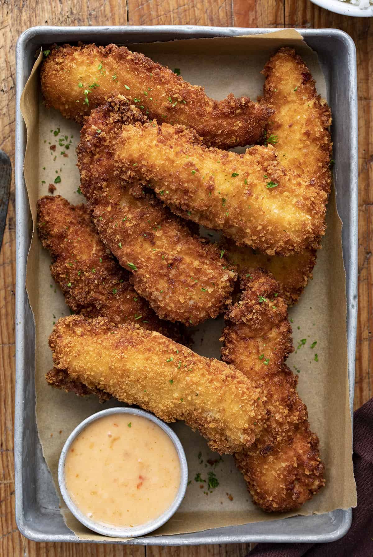 Pan of Crispy Bang Bang Chicken Tenders with Sauce. Dinner, Supper, Bang Bang Sauce, Bang Bang Chicken Recipe, Chicken Recipes, Appetizer, Crispy Fried Chicken Recipe, How to Cook Chicken Tenders, recipes, i am homesteader, iamhomesteader