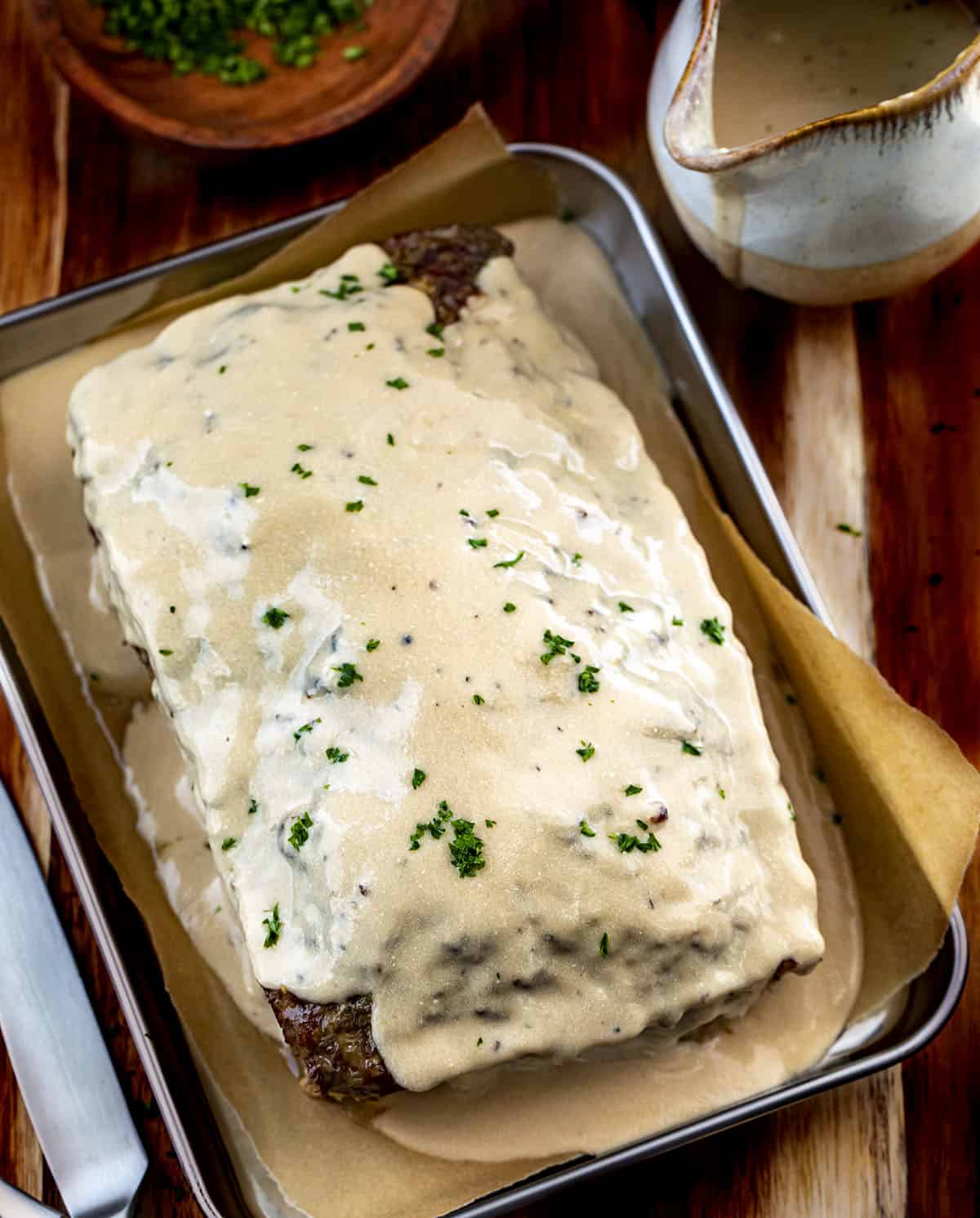 Pan of Swedish Meatloaf Next to the Sauce.