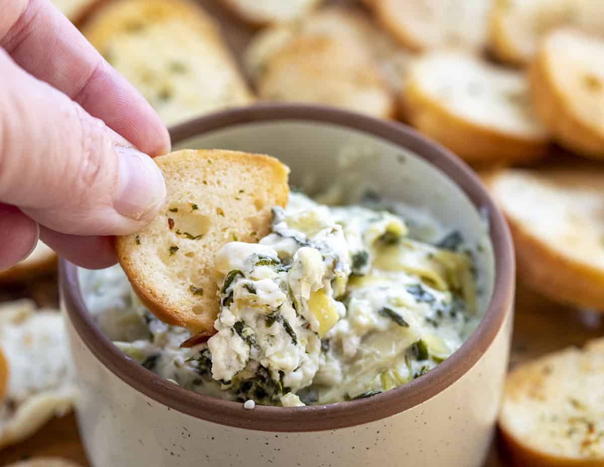 Dipping Bagel Chip into Spinach Dip. Appetizer, Bagel Chip Recipes, Bagel Chips for Dip, Homemade Bagel Chips, Game Day Food, Super Bowl Recipes, Dips, Bagel Chips Air Fryer, Baked Bagel Chips, Bagel Chips Garlic, Stacys Bagel Chips Recipe, i am homesteader, iamhomesteader