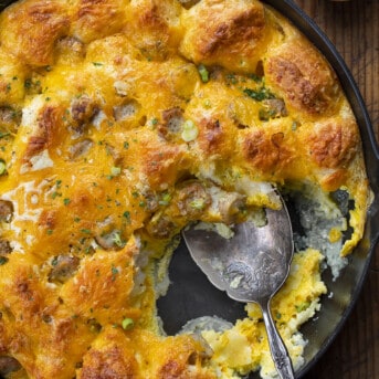 Cheesy Biscuits and Gravy Bake with Some Removed and a Spoon in the Pan. Breakfast, Breakfast Bake, Easy Breakfast, Brunch, Biscuits and Gravy Breakfast, Easy Breakfast Recipes, Cheesy Eggs, Kid Favorite Breakfast, Easy Recipes, Breakfast for Dinner, i am homesteader, iamhomesteader
