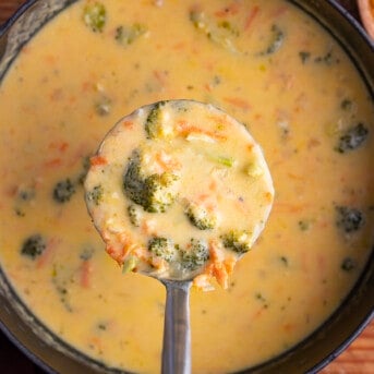 Scoop of Broccoli Cheese Soup in Ladle Coming out of Pot. Dinner, Soup, Meatless Soup, Soup Recipes, Cheese Soup. Broccoli Cheese, Panera Copycat Broccoli Cheddar Soup, Creamy Soup, winter soups, holiday soup, i am homesteader, iamhomesteader