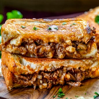 Shredded Beef Birria Grilled Cheese Sanwich Cut in Half and Inside Showing on Cutting Board. Dinner, Supper. Grilled Cheese, Best Grilled Cheese, Birria Grilled Cheese Sandwich, Shredded Beef Grilled Cheese, Superbowl Food, Game Day Food, Football Recipes, i am homesteader, iamhomesteader