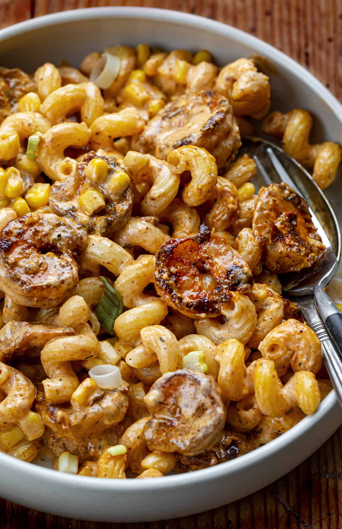 Bowl of Blackened Shrimp Cavatappi with Knife and Fork Nestled In.