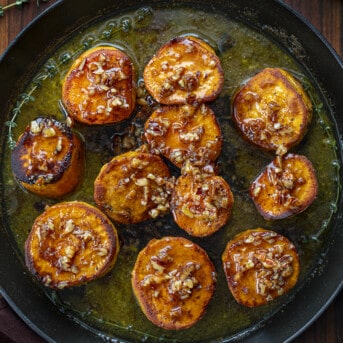 Pan of Fondant Sweet Potatoes Covered in Bourbon Pecan Glaze.