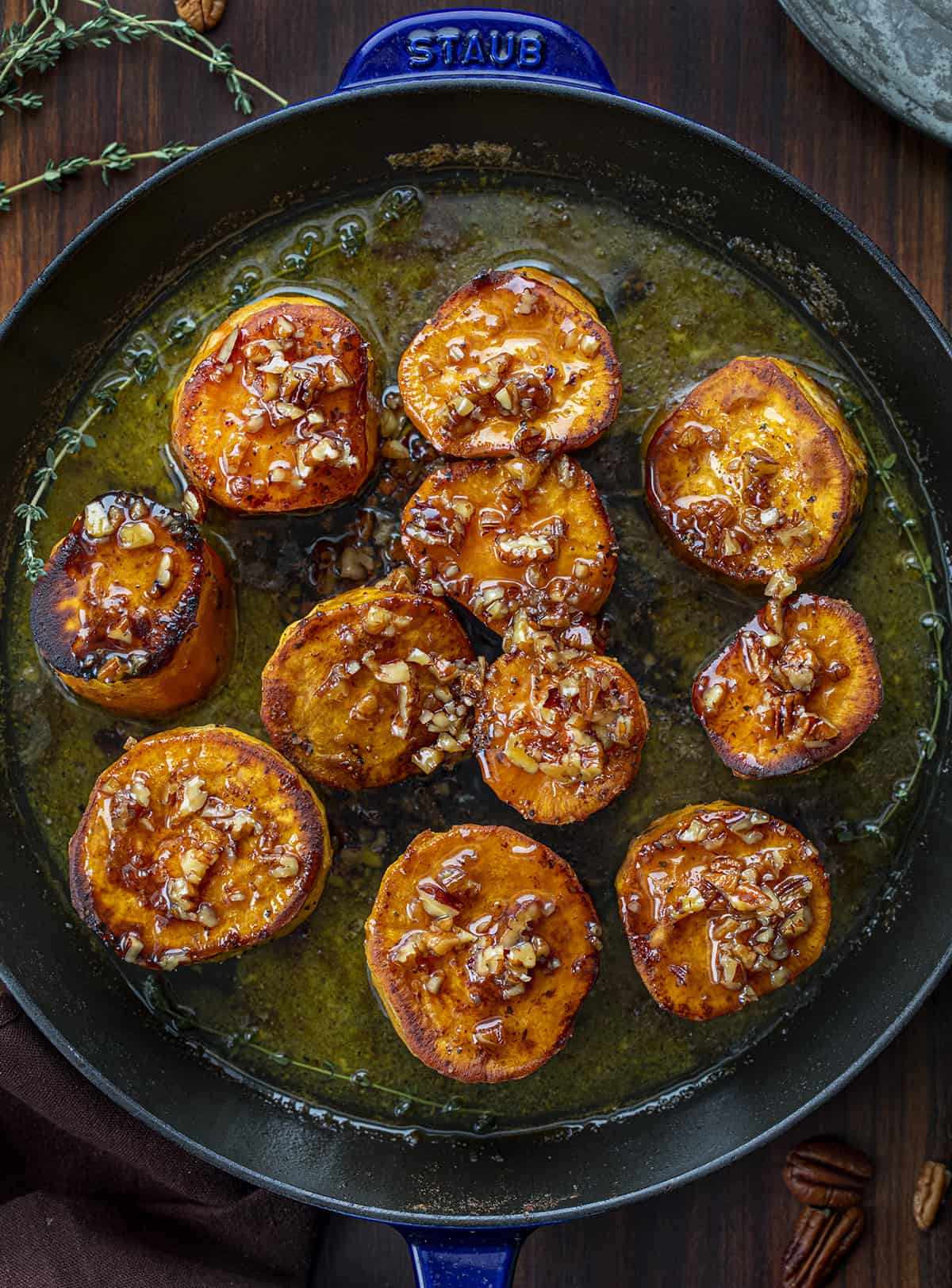 Pan of Fondant Sweet Potatoes Covered in Bourbon Pecan Glaze.