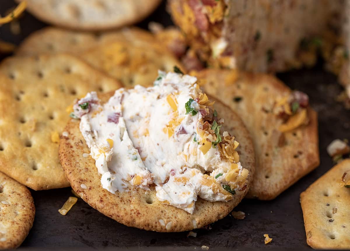 Classic Cheese Ball that Has Been Spread on a Big Cracker.