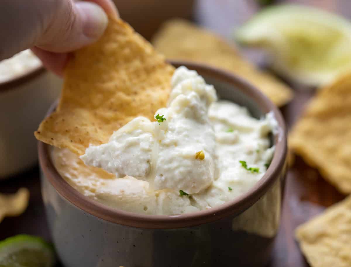 Dipping a Chip into Easy Queso.