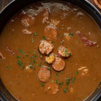Pot of Gumbo with a Few Ingredients Sitting on Top.