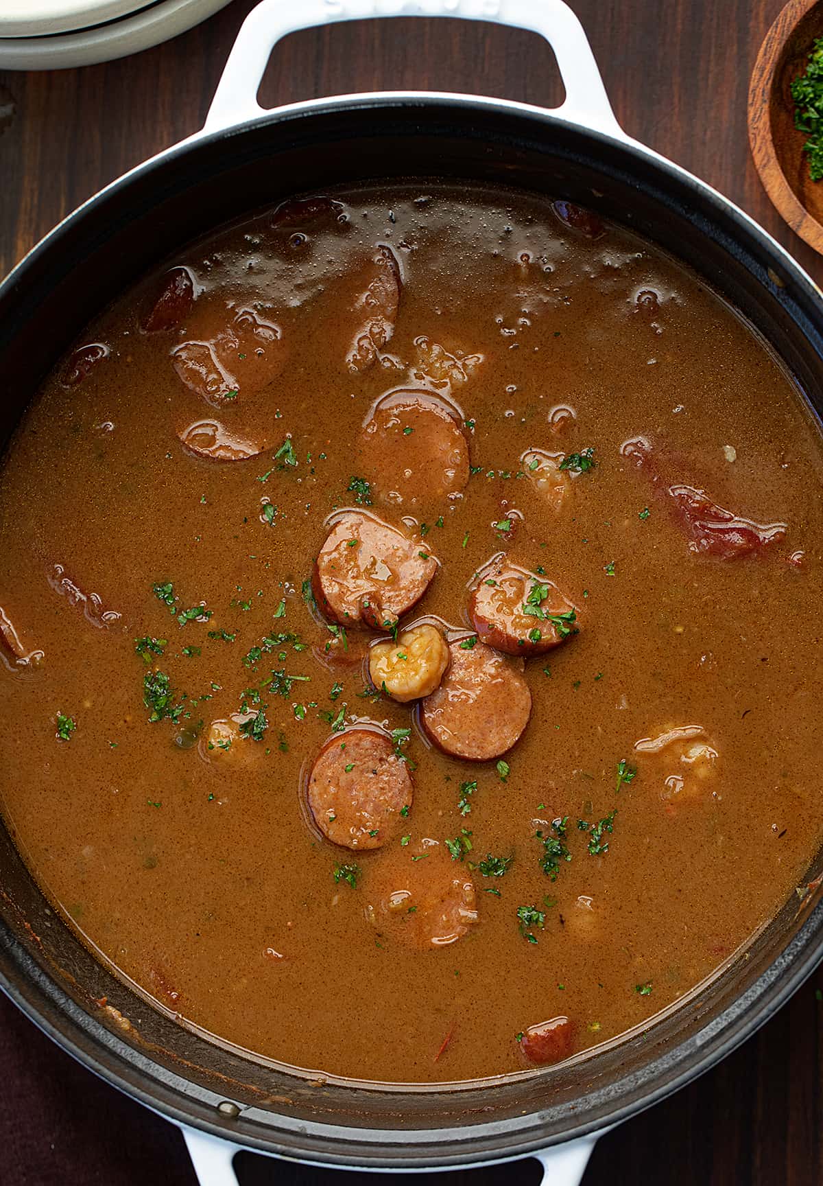 Pot of Gumbo with a Few Ingredients Sitting on Top.
