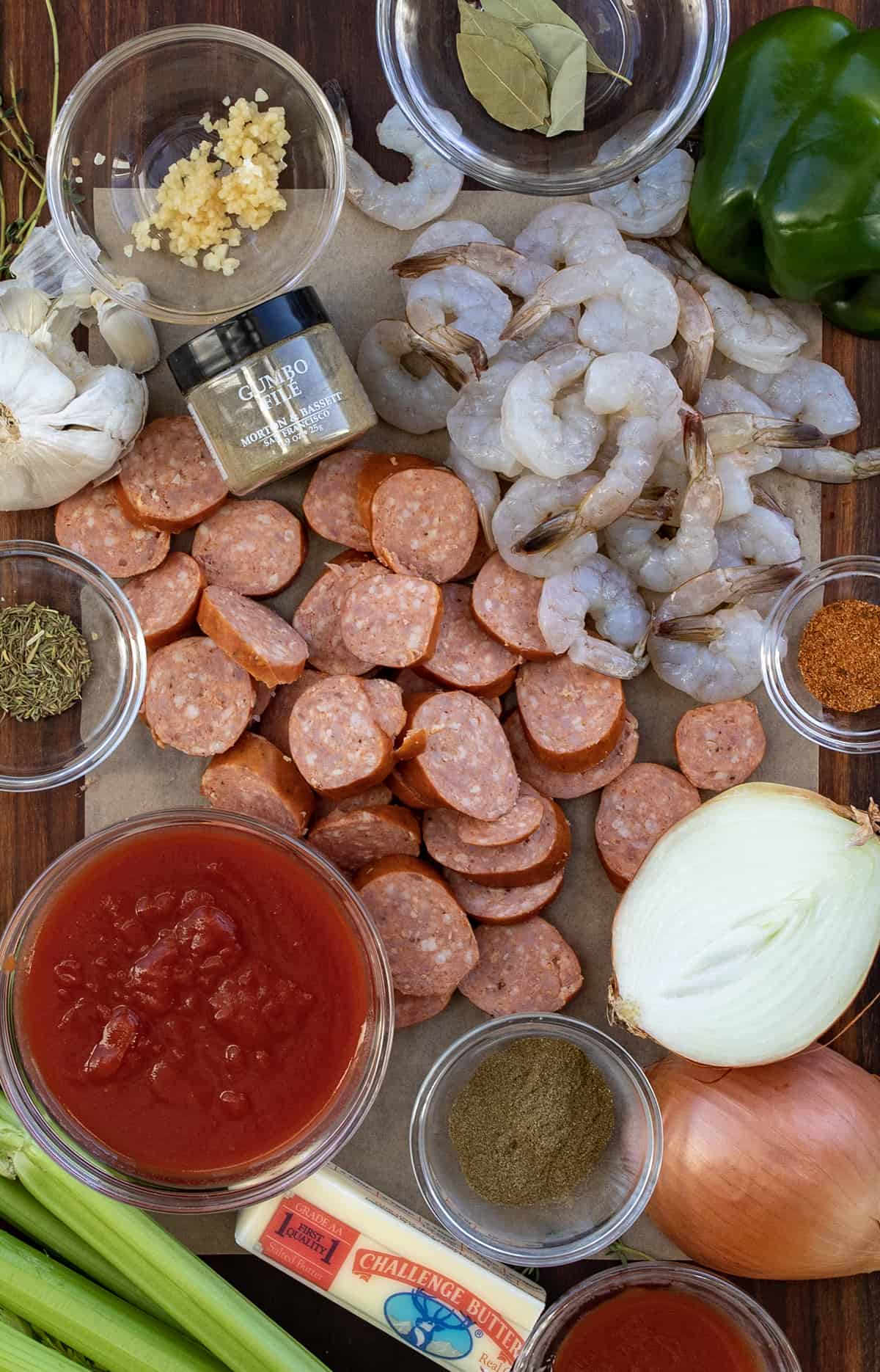 Raw Ingredients for Gumbo on a Cutting Board.