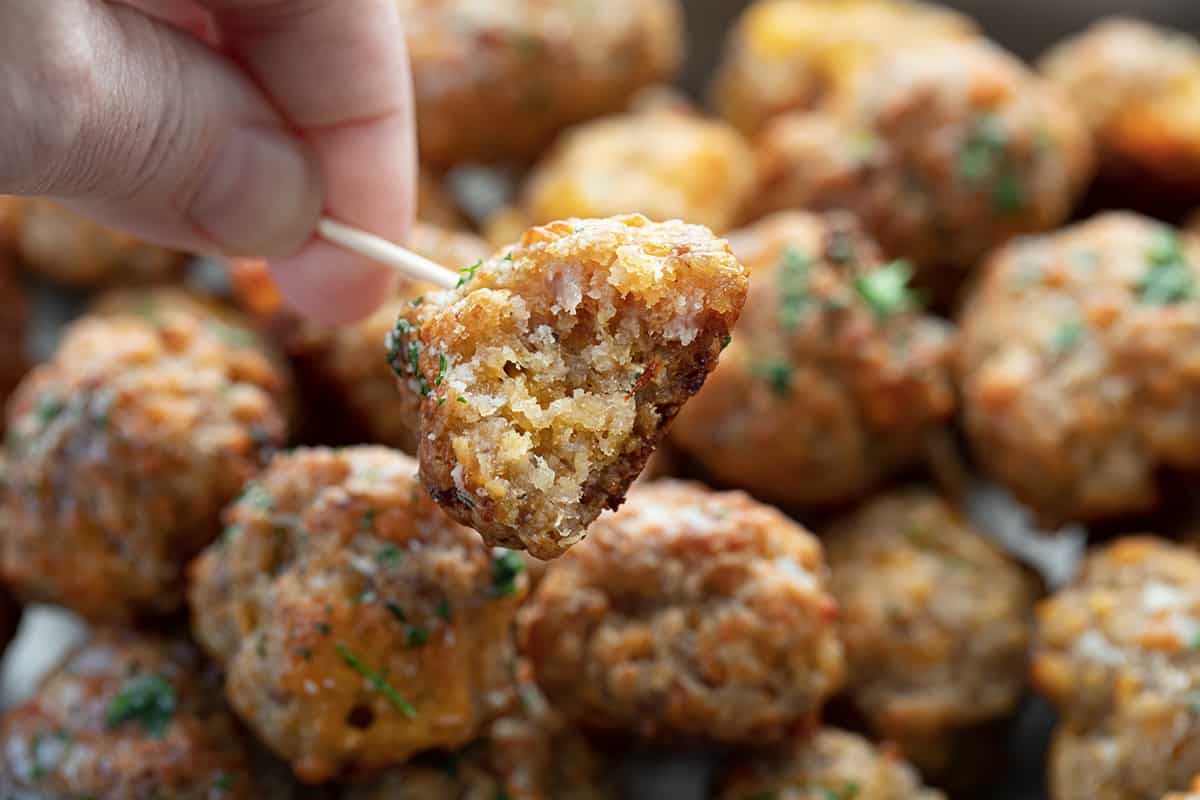 Sausage Ball on a Toothpick with a Bite Taken Out Showing Texture Inside.