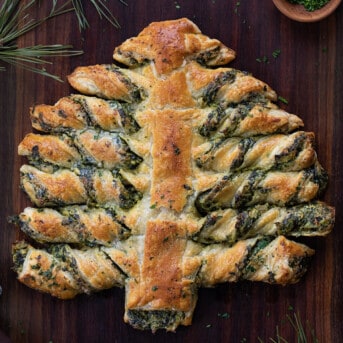 Baked Spinach Dip Pull-Apart Christmas Tree on a Cutting Board.