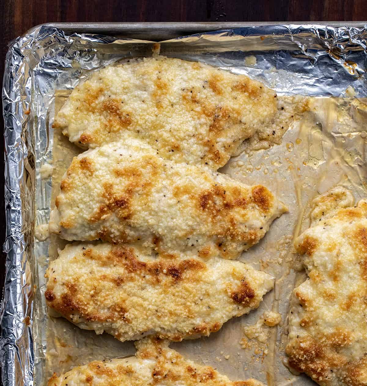 Baked Mayo Chicken on a Sheet Pan Lined with Aluminum Foil.