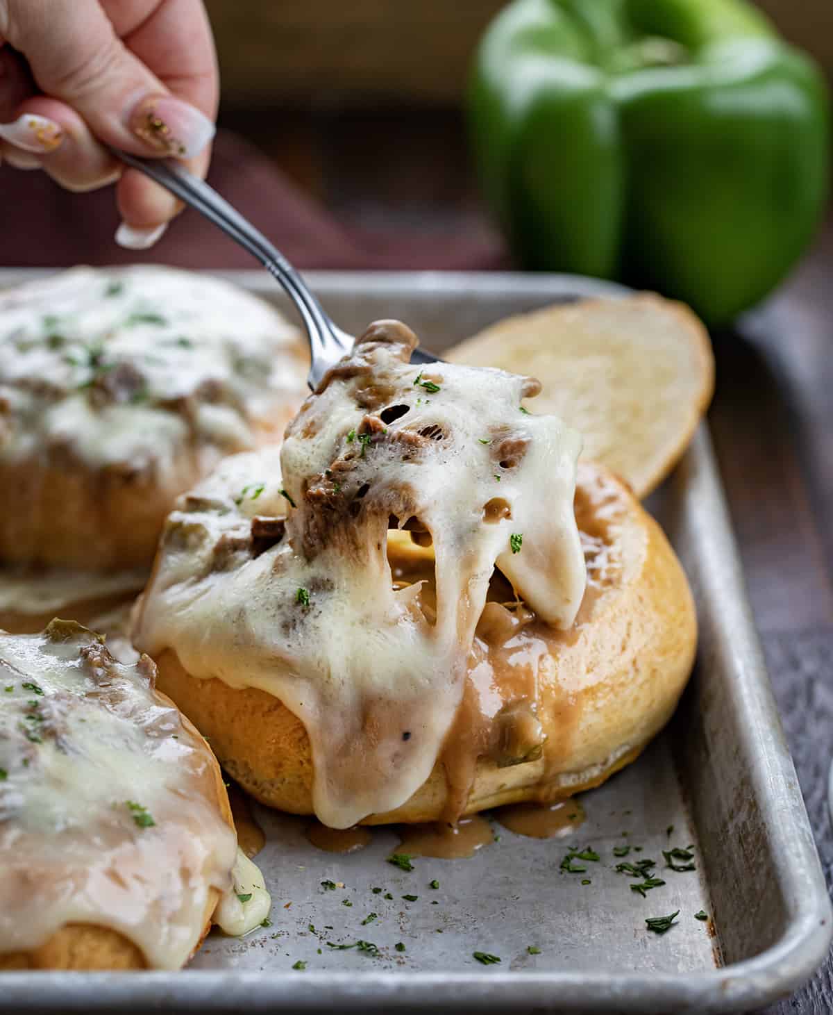 Spoonful of Philly Cheesesteak Stew with Cheese Pulling