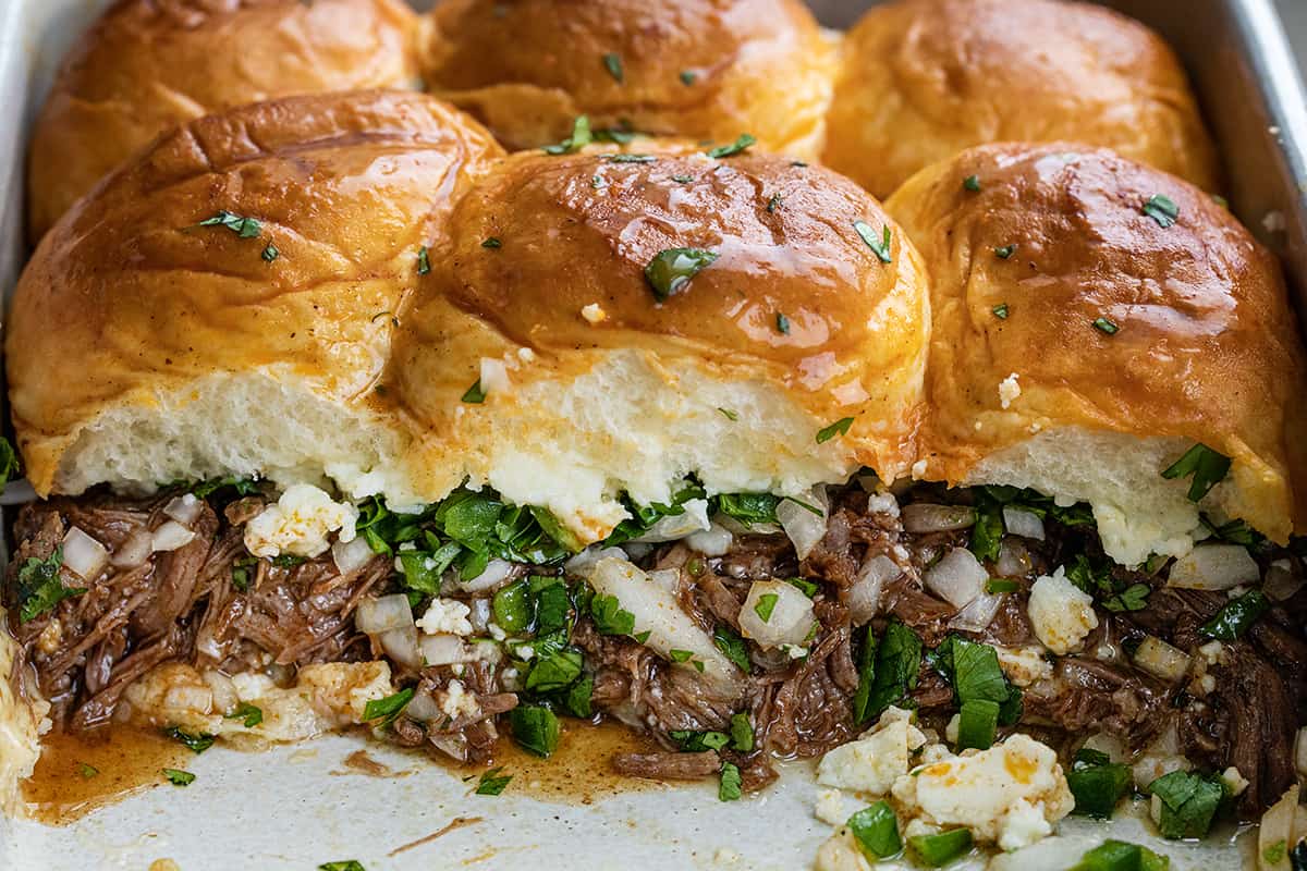 Shredded Beef Sliders in the Pan with a Row Removed, showing the Inside.