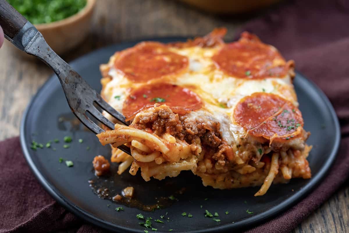 For taking a bite out of a piece of Spaghetti Pizza Casserole.