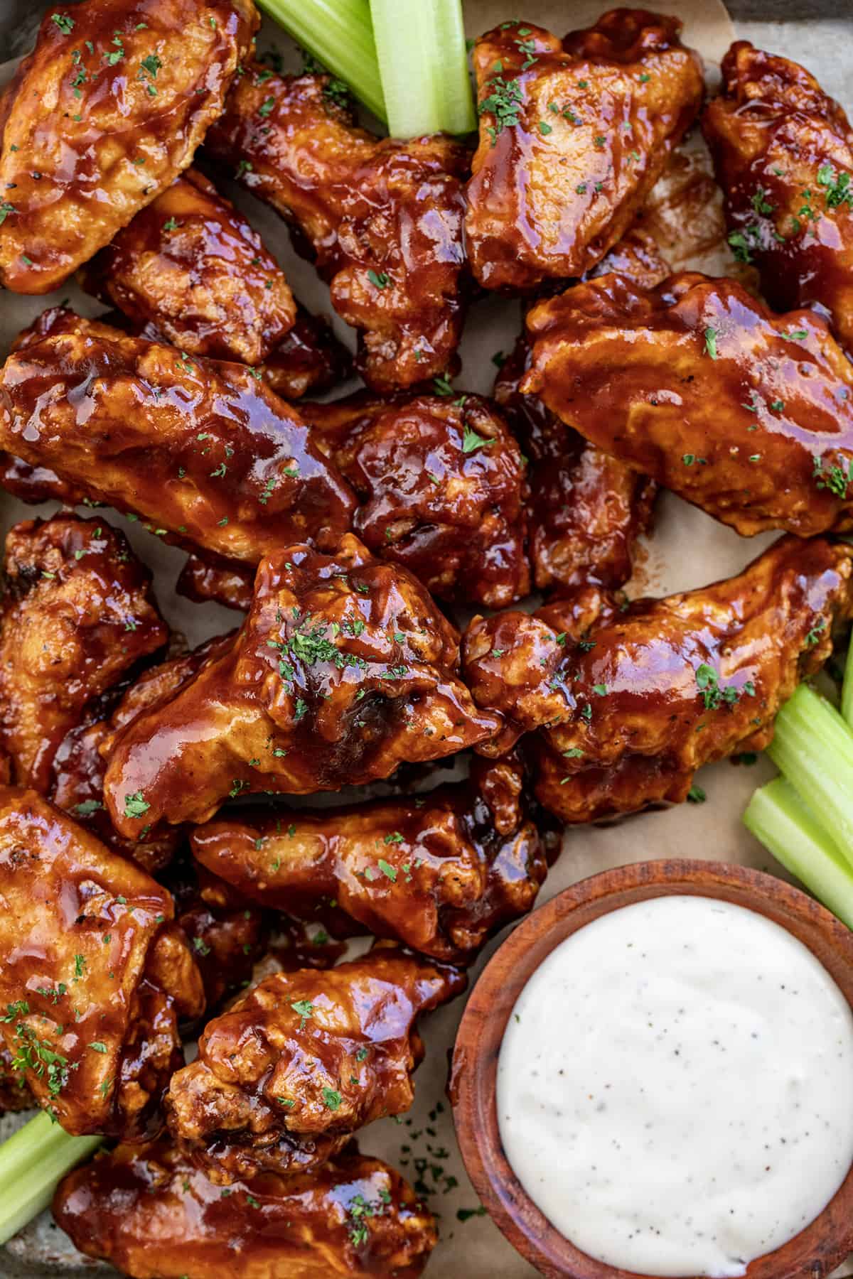 Close up of BBQ Wings with Homemade Ranch Dressing.