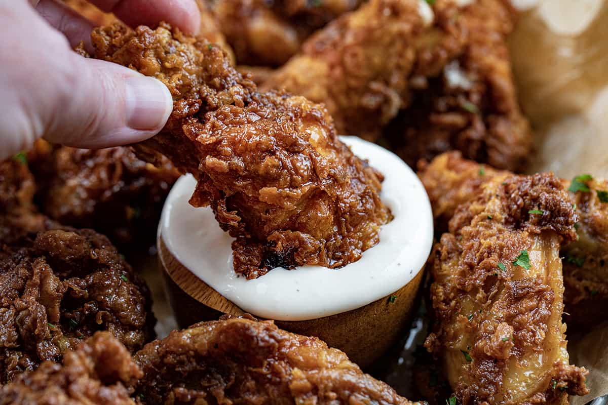 Dipping a Buffalo Honey Mustard Wing into Homemade Ranch Dressing.