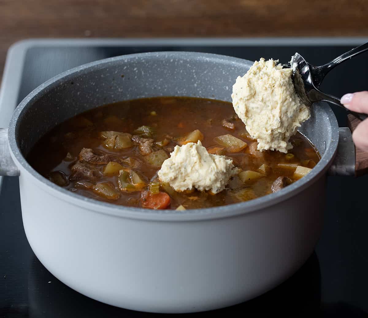 Adding Dumplings to a Pot of Beef Stew.