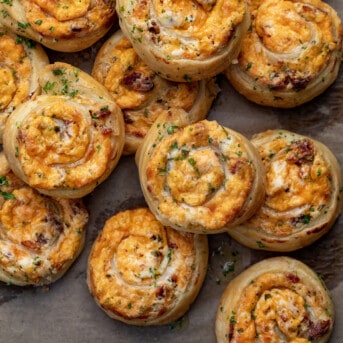 Group of Jalapeno Popper Pinwheels on a Parchment Paper