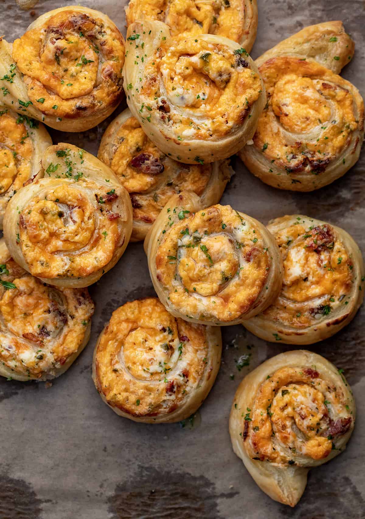 Group of Jalapeno Popper Pinwheels on a Parchment Paper