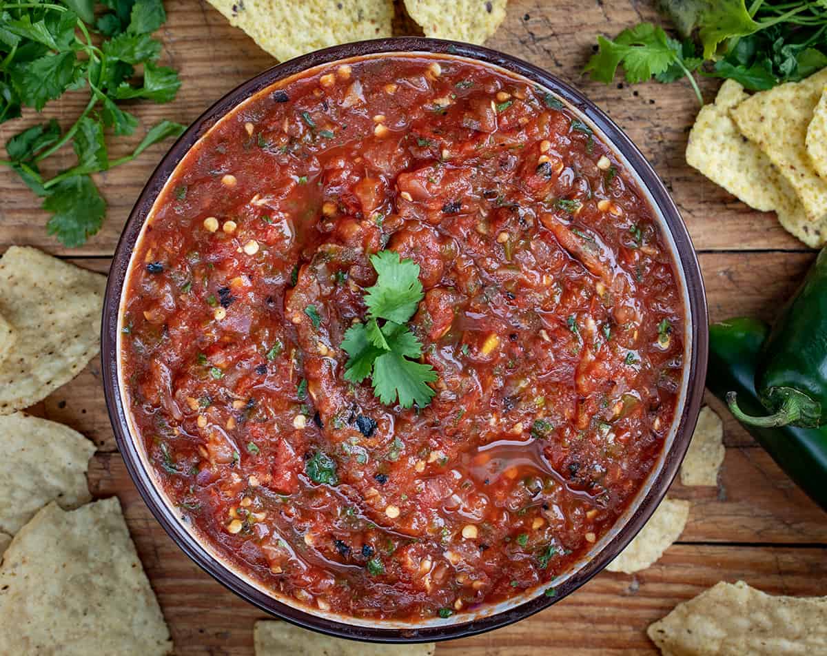 Bowl of Roasted Salsa with Chips on Cutting Board.