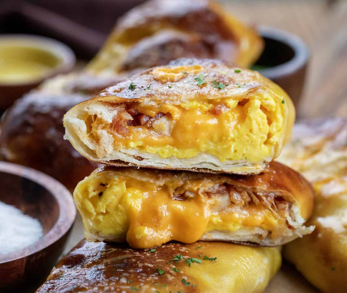 Cut into Stuffed Breakfast Pretzel Rolls Showing Melted Cheese.