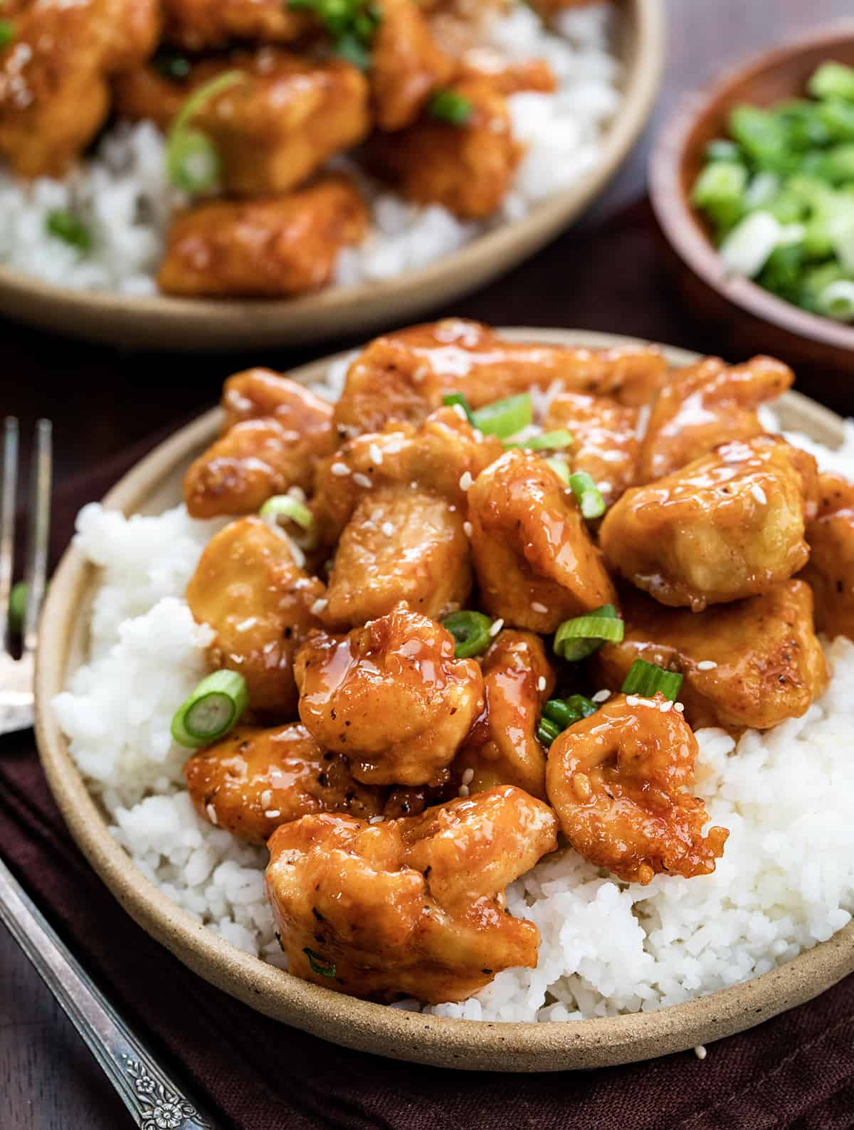 Plates of Sweet Chili Chicken Over Rice.