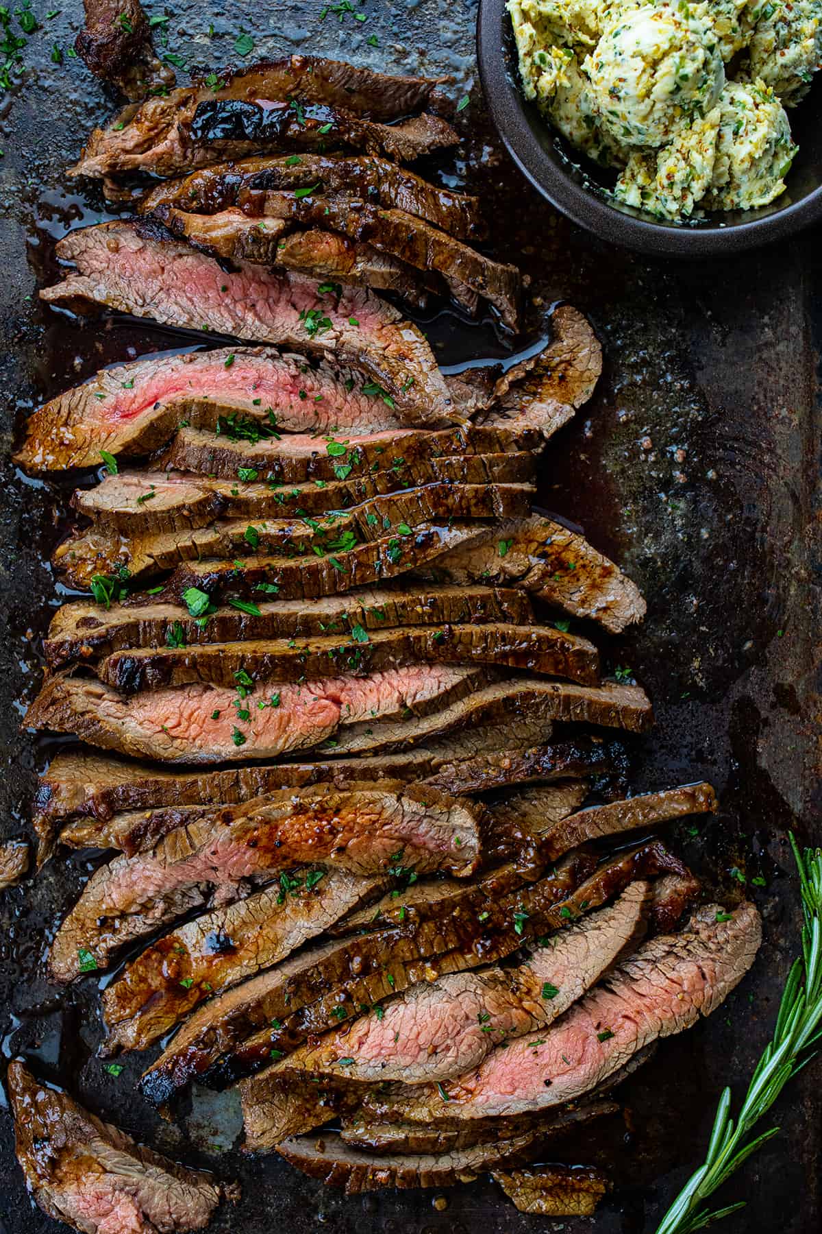 Cut Up London Broil on a Sheet Pan with Butter and Rosemary.
