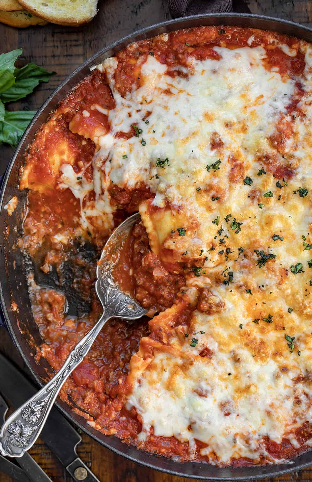 Spoon in a pan of Skillet Ravioli.