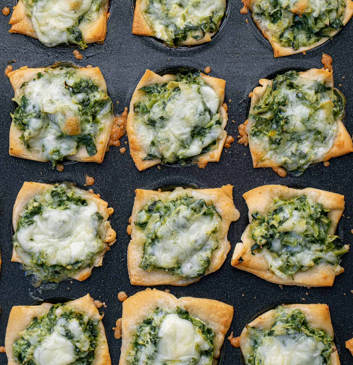 Pan of Just Baked Spinach Dip Bites Close up in The Pan.