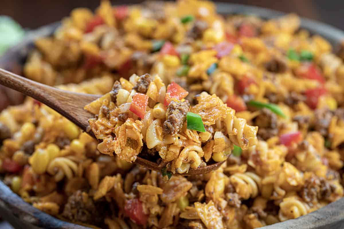 Spoonful of Taco Pasta Salad In Front of the Bowl.