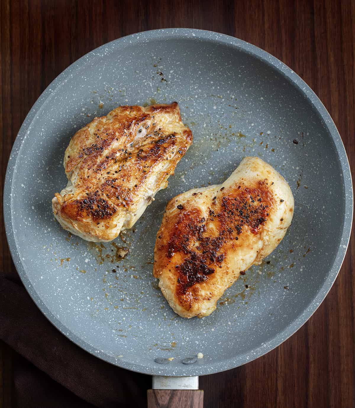 Chicken in a Pan After Cooking and Ready to be Cut for Asiago Chicken Pasta.