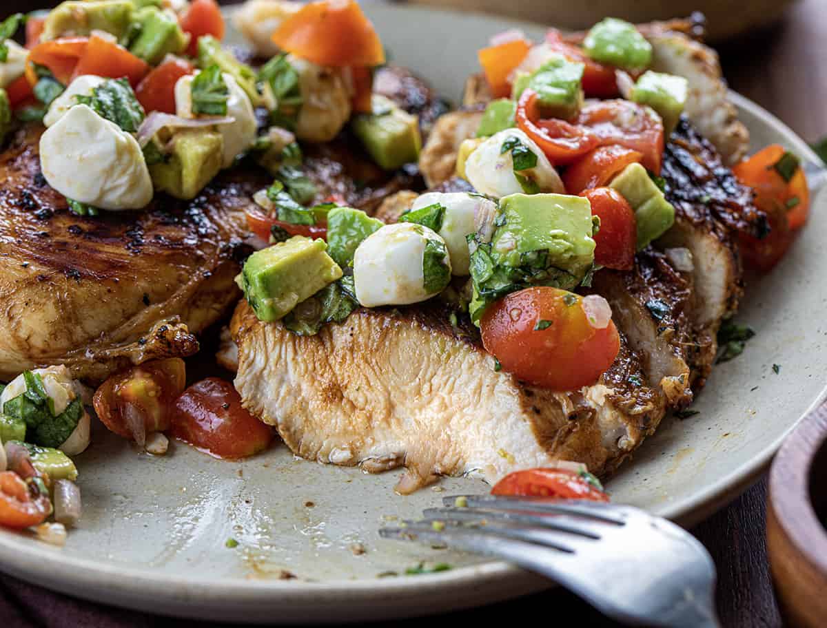 Cut Into Balsamic Chicken With Caprese Salsa Showing the Juicy Chicken Texture.