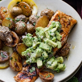 Plated Sheet Pan Lemon Salmon and Potatoes with the Fresh Avocado Salsa.