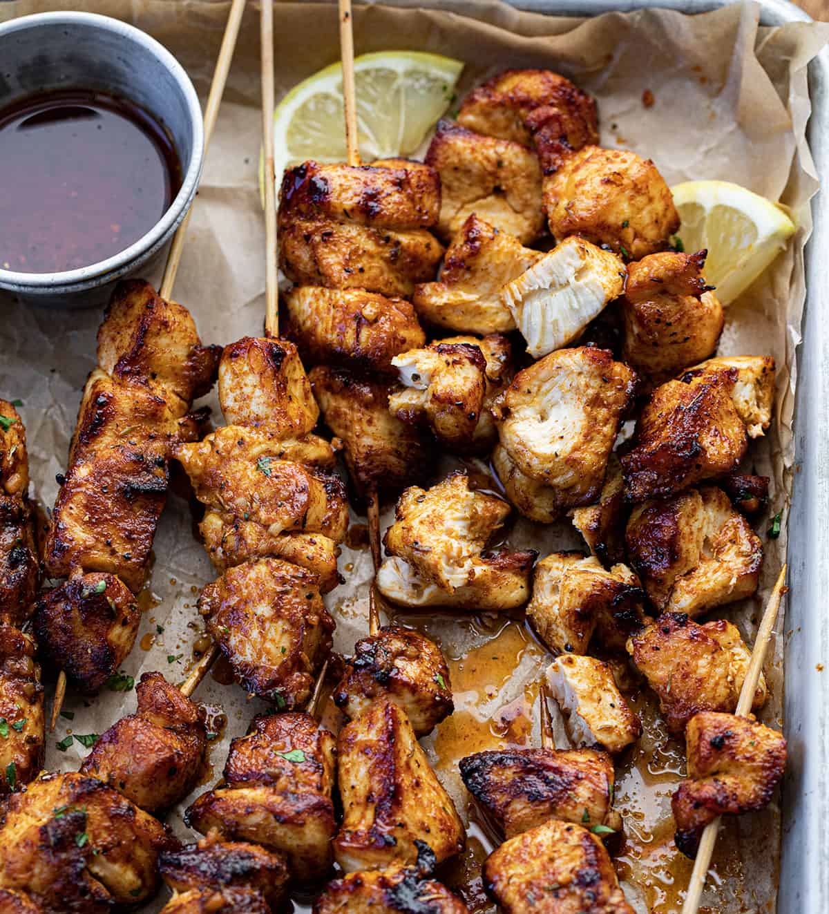 Lemon Pepper Chicken Skewers with Some of the Chicken Removed From the Skewers.