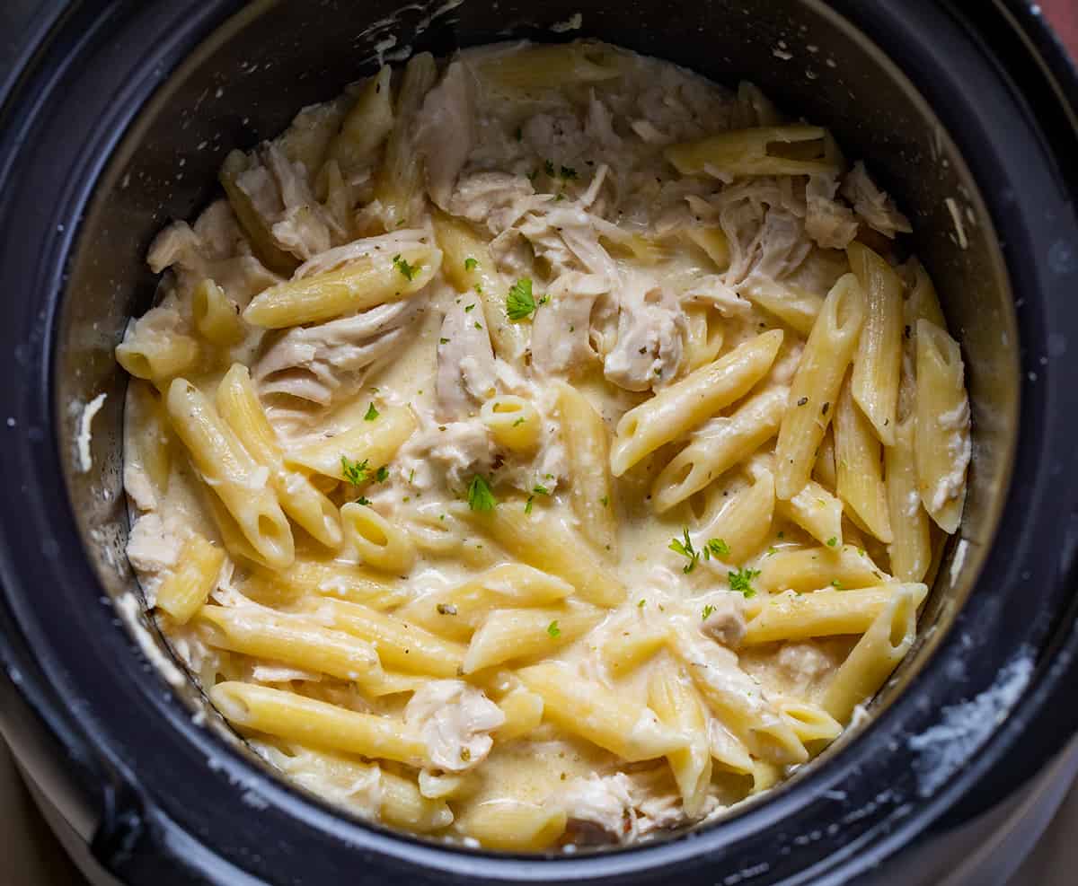 Olive Garden Chicken Pasta in a Black Crock Pot.